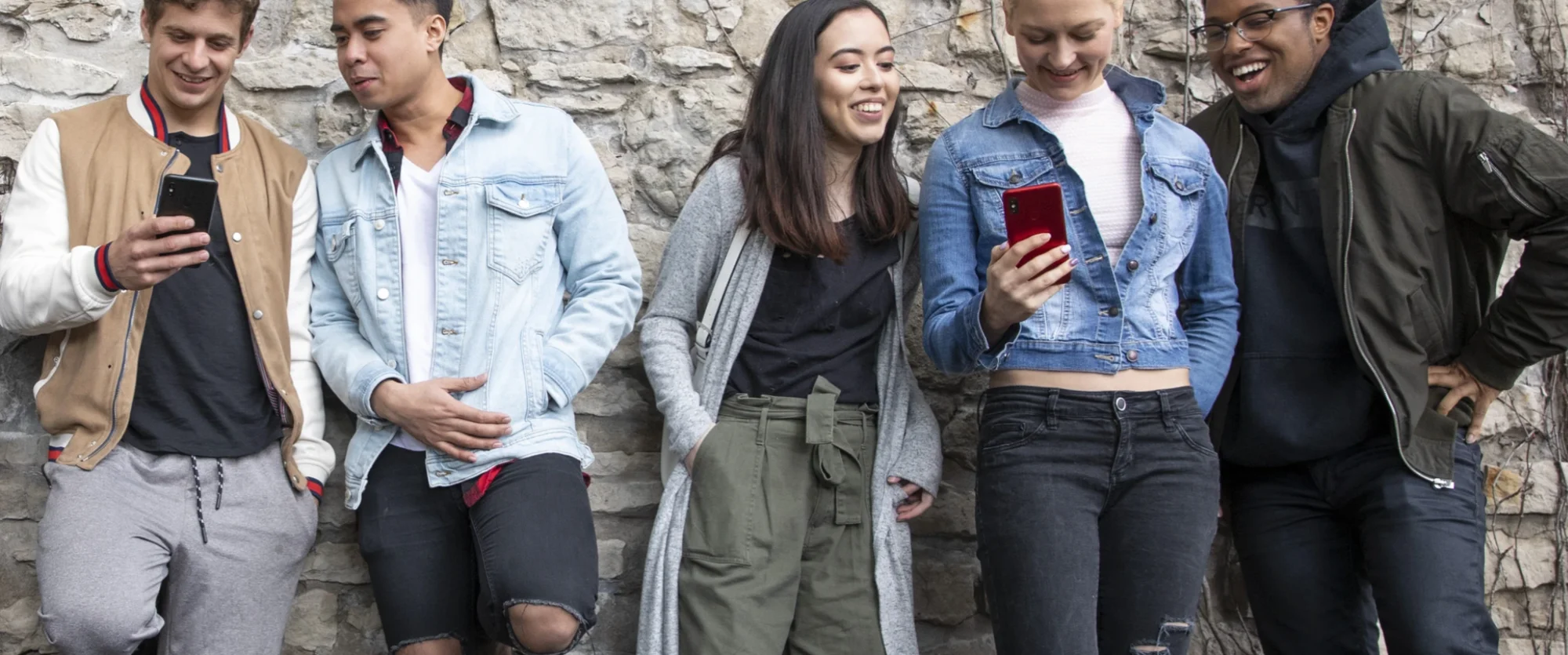 Friends looking at their OHANA phones